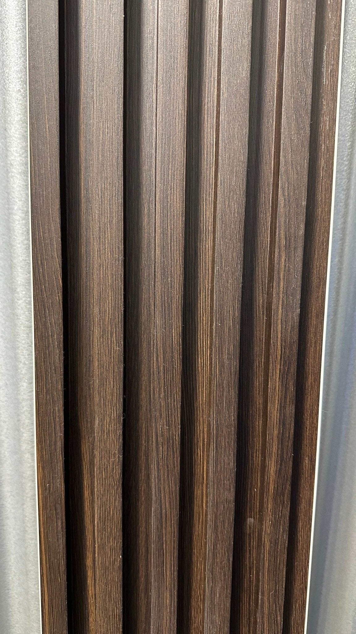 Dark brown fluted wall panels with rustic vertical grain, premium quality, stylish design, easy to install in NJ.