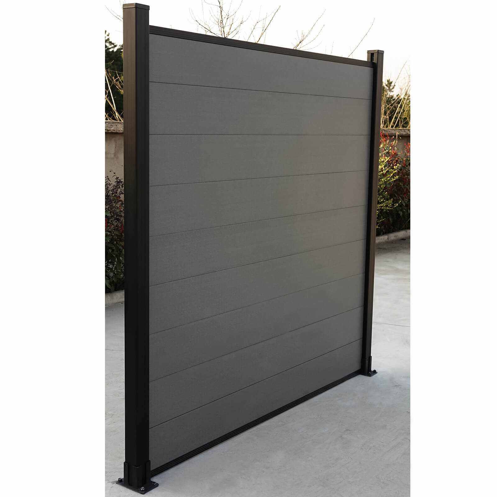 Silver gray composite fence with horizontal planks, black metal posts, and durable design, perfect for NJ homes.