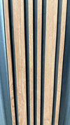 Light brown WPC wall panel with natural wood grain, black gaps, and sleek vertical stripes, available in NJ.