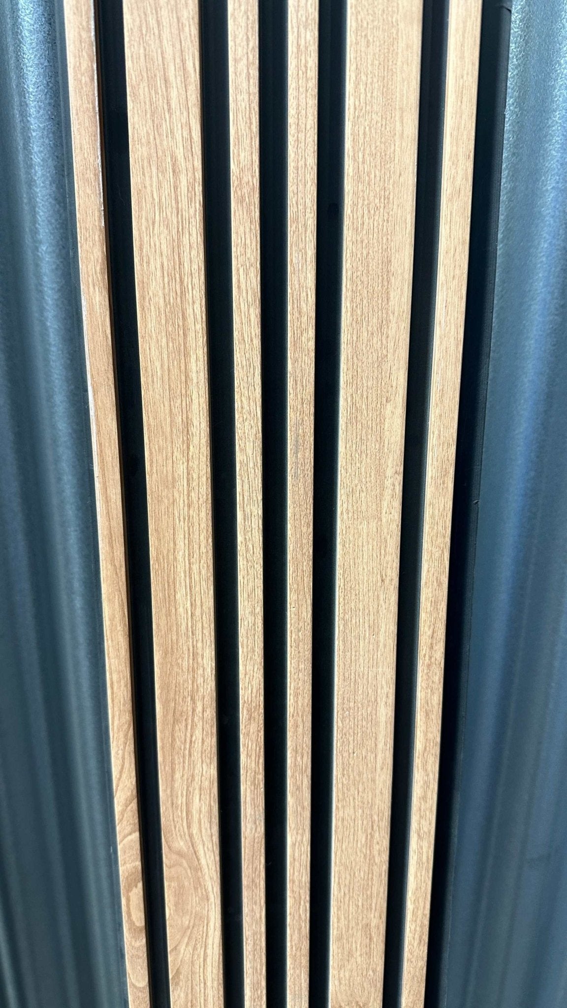 Light brown WPC wall panel with vertical black stripes, modern design, high-quality finish, perfect for NJ homes.