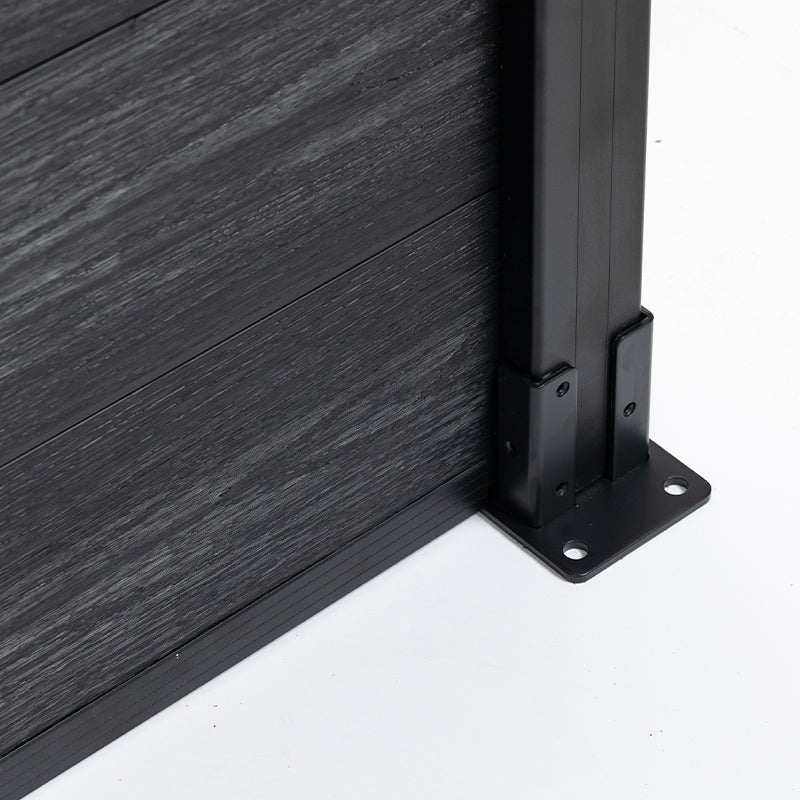 Black composite fence with dark gray wood-like texture, supported by sleek metal posts, perfect for NJ outdoor spaces.