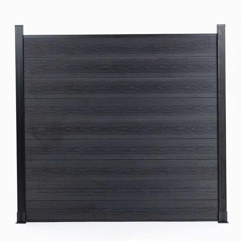 Black composite fence with wood grain texture co-extrusion, supported by dark metal posts - durable, stylish in New Jersey