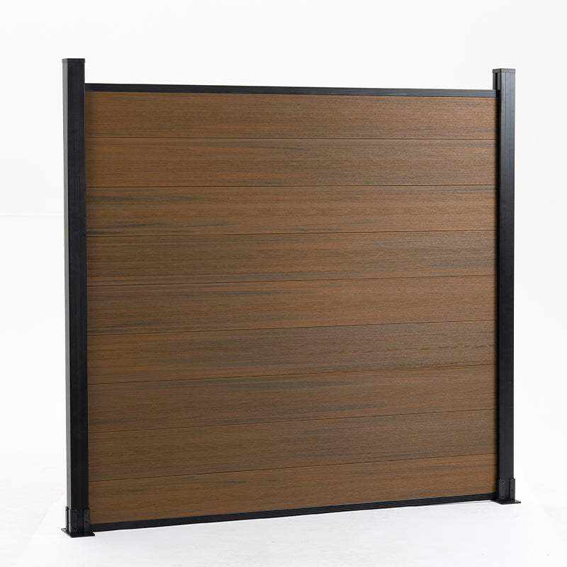 Brown composite fence with walnut wood grain, supported by black metal posts, available at wholesale prices in NJ.