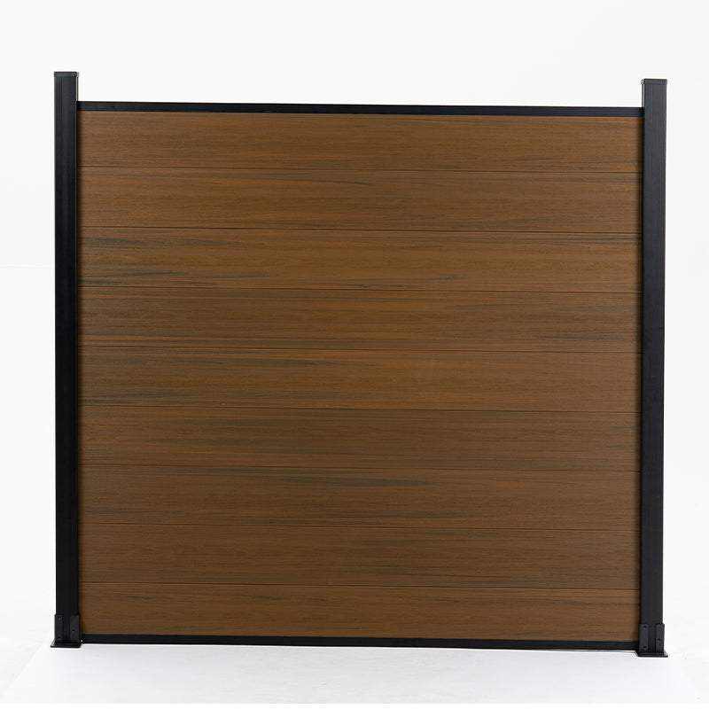 Brown composite fence with walnut wood grain pattern, supported by black metal posts, available at wholesale prices in New