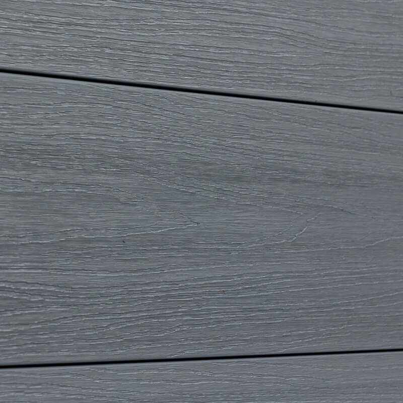 Gray wood-grain vinyl composite fence in excellent condition, durable horizontal planks, perfect for NJ homes.