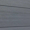 Gray wood-grain vinyl composite fence in excellent condition, durable horizontal planks, perfect for NJ homes.