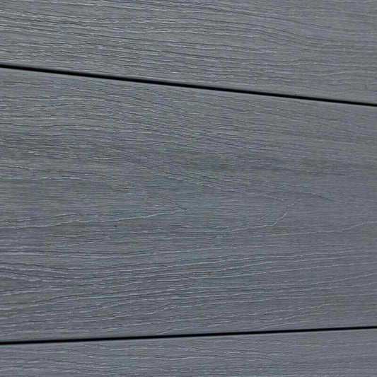 Gray wood-grain vinyl composite fence in excellent condition, durable horizontal planks, perfect for NJ homes.