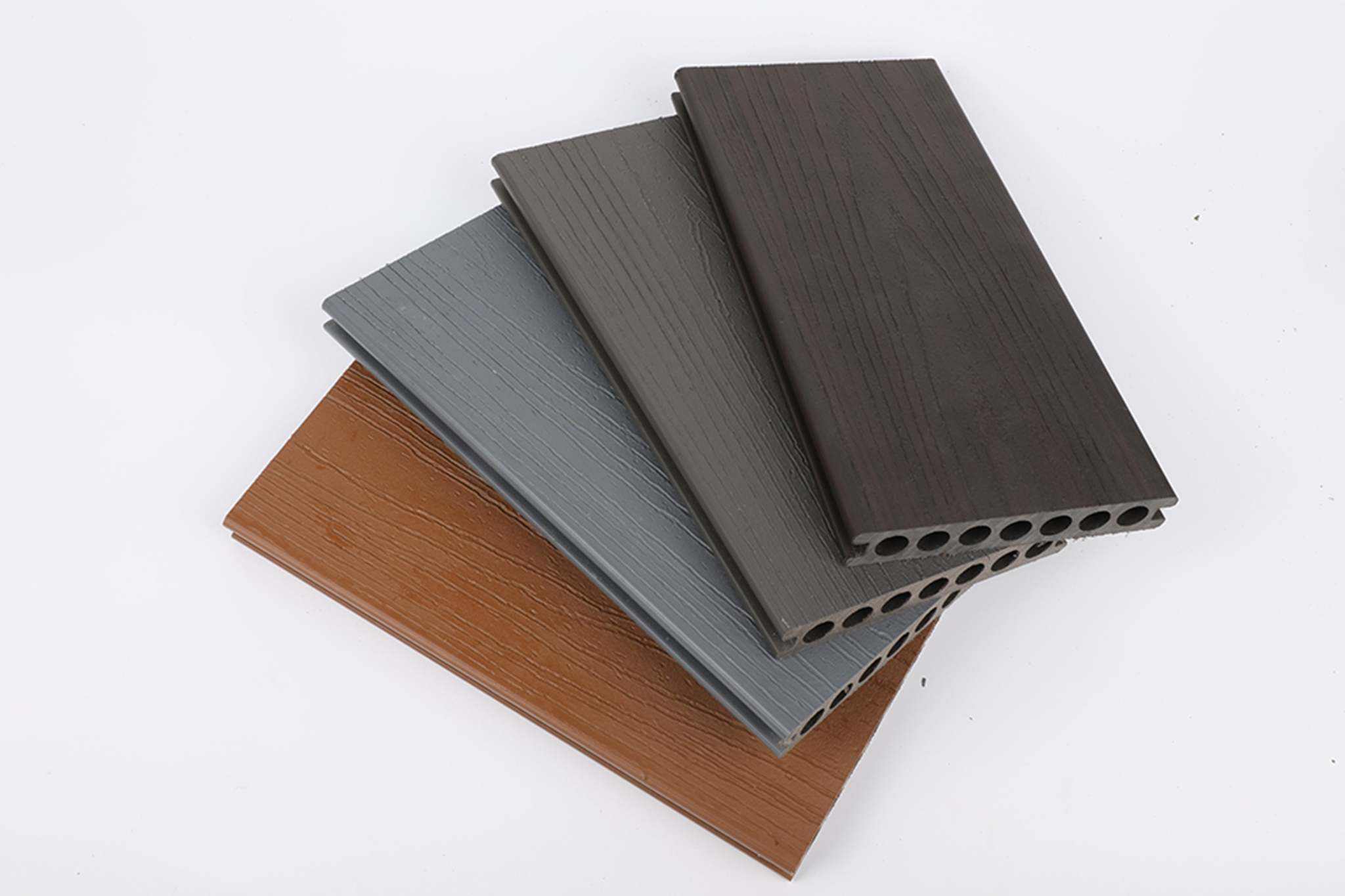 Teak composite deck boards in rich brown wood grain, co-extruded with Ultra Guard for durability, available in NJ.