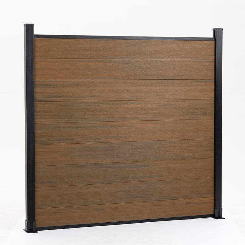 Brown composite fence with walnut wood grain, supported by black metal posts, available wholesale in NJ.