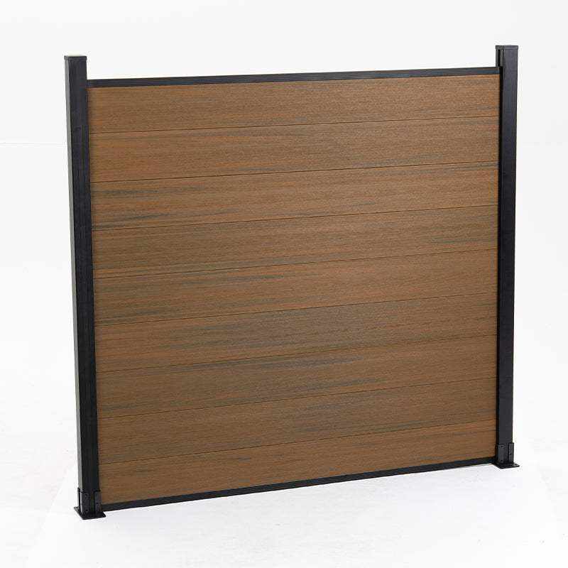 Brown composite fence with walnut wood grain texture, supported by black metal posts, available wholesale in NJ.