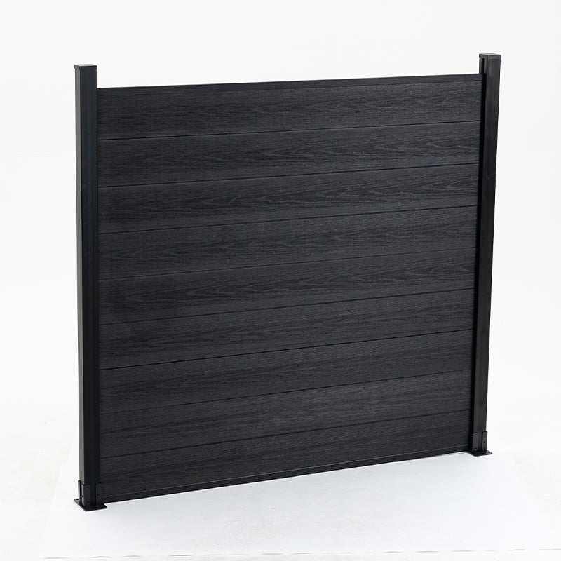 Black composite fence with horizontal staggered planks, co-extruded for durability, supported by black posts - NJ wholesale