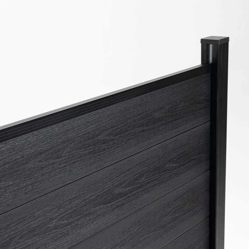 Black composite fence with smooth wood grain planks on a gray metal frame, durable and stylish, available wholesale in NJ