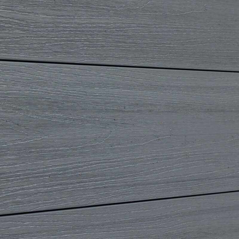 Light gray composite fence with staggered horizontal planks, durable and stylish, perfect for NJ homes.