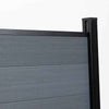 Light gray composite fence with wood grain texture, supported by black metal posts, available at discounted prices in NJ.