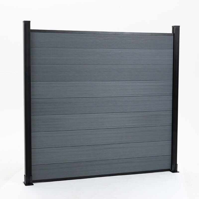 Dark gray composite fence with wood grain texture, horizontal planks, supported by black metal posts, available in NJ.