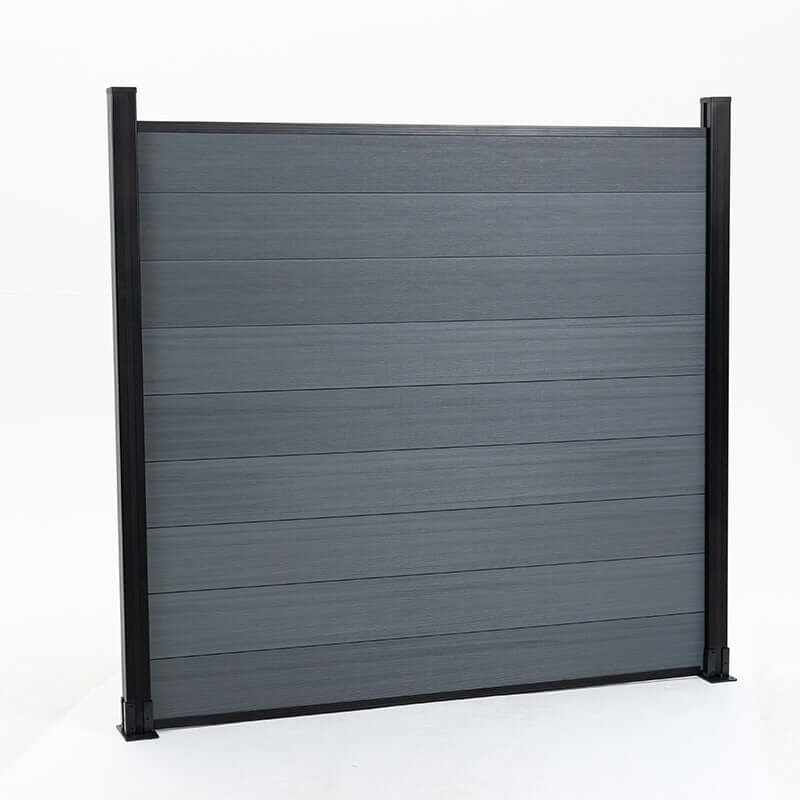 Light gray composite fence with wood grain texture, supported by black metal posts, available at discounted prices in New