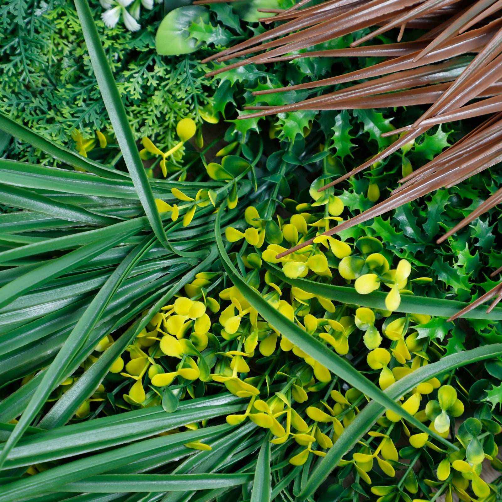 Realistic UV-resistant artificial grass wall panel with lush green leaves and yellow flowers, perfect for NJ indoor &