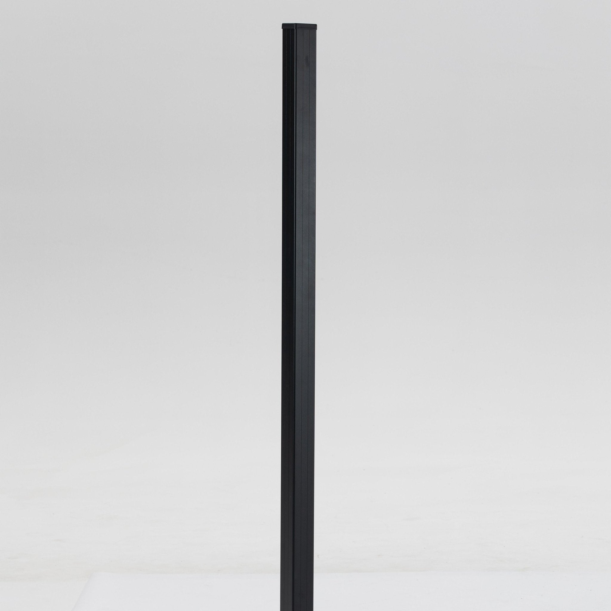 Black square metal fence post with smooth surface, standing upright, available for wholesale and installation in NJ.