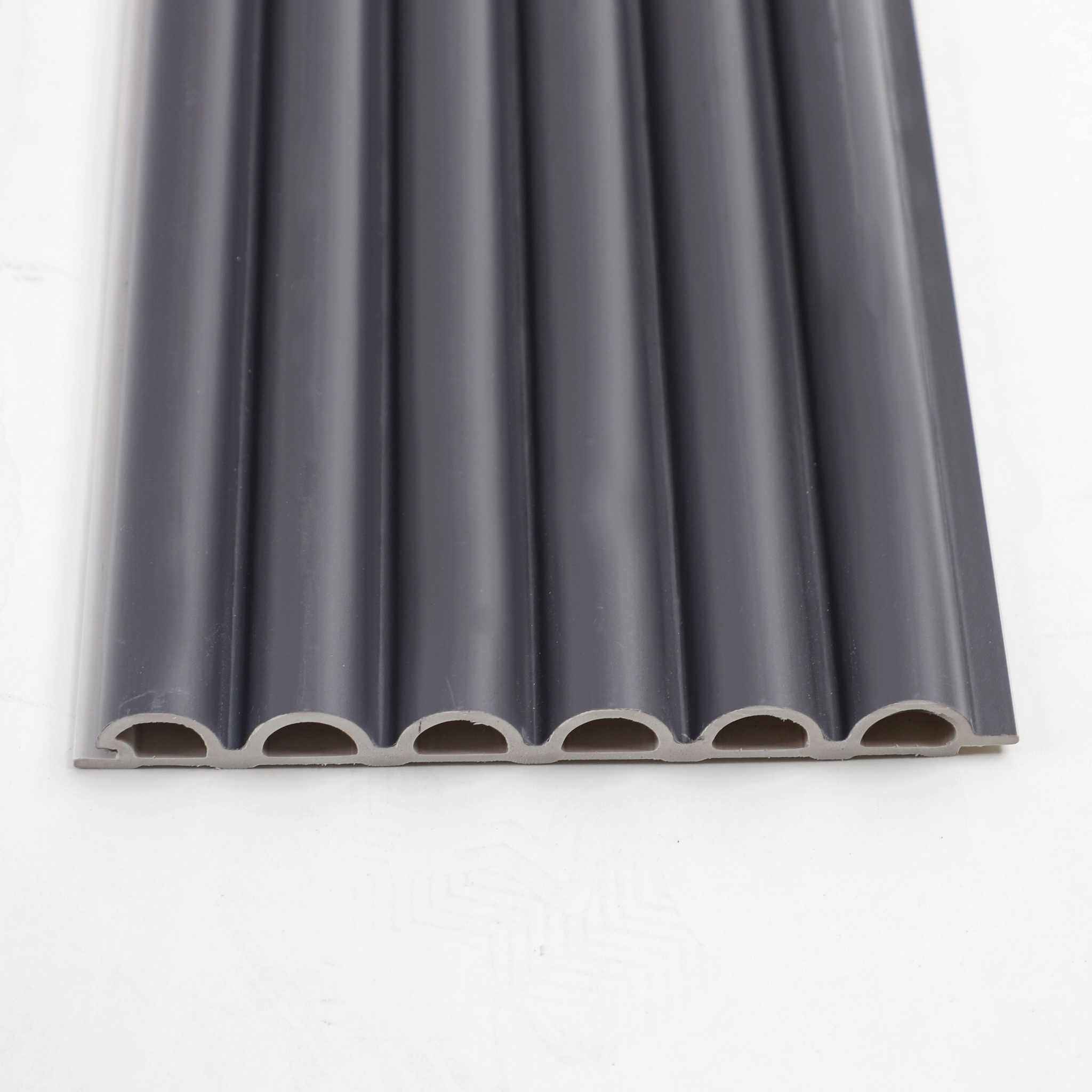 Gray WPC corrugated sheet with ribbed texture, round hole design, high-quality roofing or siding material in NJ.