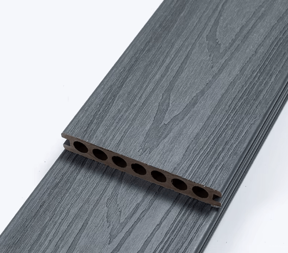 Dark gray composite deck board with wood grain texture, 6 in. wide, 1 in. thick, beveled & grooved edges, durable for NJ