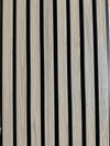 Light brown wood-grain composite wall cladding panels with vertical black lines, durable co-extruded design, perfect for NJ