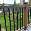 Dark brown composite railing kit with vertical boards, durable & low-maintenance, perfect for NJ backyards with flower